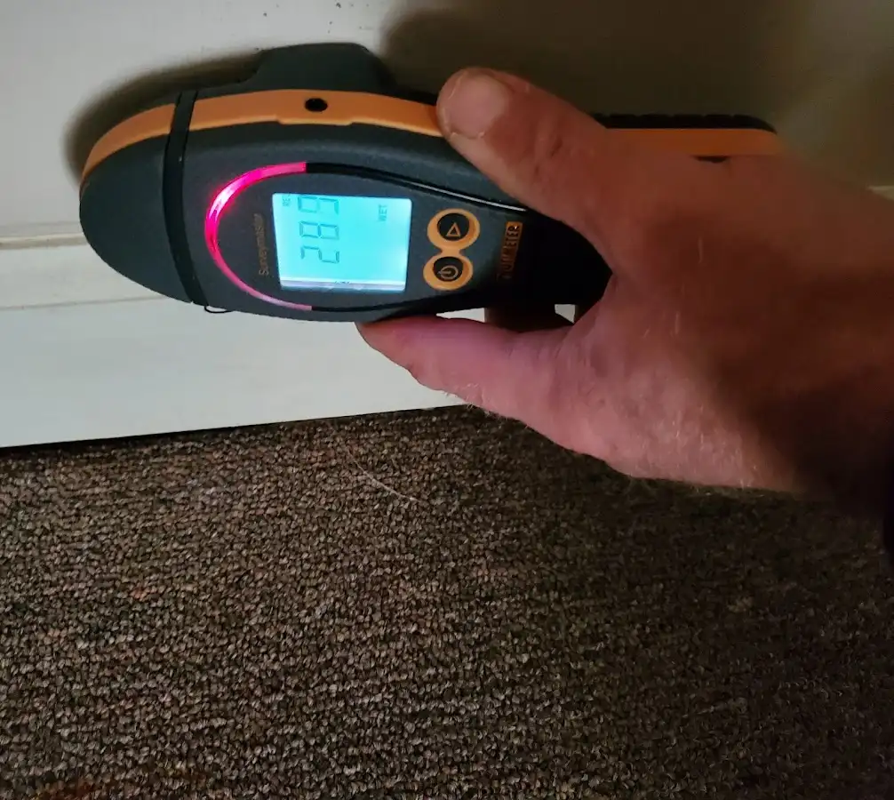 Moisture detection at baseboard during Storm Damage Restoration in Martins Ferry